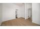 A bright bedroom features a vaulted ceiling and an open doorway to the bathroom at 4445 E Roma Ave, Phoenix, AZ 85018