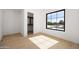 Bright bedroom features a large picture window, hardwood floors, and closet space at 4445 E Roma Ave, Phoenix, AZ 85018