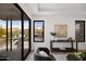 Sunlit living room features comfortable seating, sliding glass doors with mountain views, and stylish decor at 4445 E Roma Ave, Phoenix, AZ 85018