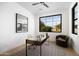 Bright office features a modern desk, chair, and large window at 4445 E Roma Ave, Phoenix, AZ 85018