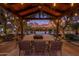 Covered patio with dining area and mountain views at 4715 N Launfal Ave, Phoenix, AZ 85018