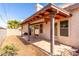 Covered patio with tile flooring and retractable shade at 562 N Aspen Dr, Chandler, AZ 85226