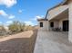 Expansive outdoor patio with pavers and desert landscaping, great for entertaining and relaxation at 722 N Sun Rd, Apache Junction, AZ 85119