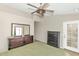 View of a bedroom with a large mirror, dresser, and a door to the outside at 8418 W Almeria Rd, Phoenix, AZ 85037