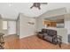 Inviting living room with wood floors and open access to the kitchen and the front entryway at 8418 W Almeria Rd, Phoenix, AZ 85037