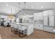 Modern kitchen with a large island, sleek white cabinetry, and stainless steel appliances at 9136 N 81St St, Scottsdale, AZ 85258