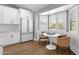 Eat-in kitchen area showcases white cabinets, stainless steel appliances, and a cozy breakfast nook with bright natural light at 9136 N 81St St, Scottsdale, AZ 85258