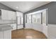 This bright kitchen features white cabinets, stainless steel appliances, and a large bay window letting in natural light at 9136 N 81St St, Scottsdale, AZ 85258