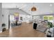 Expansive open-concept living room with a dining area, large kitchen, and bright, airy atmosphere at 9136 N 81St St, Scottsdale, AZ 85258