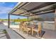 Outdoor kitchen with grill, dining area and close proximity to the refreshing pool at 9136 N 81St St, Scottsdale, AZ 85258