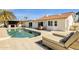 An inviting pool and lounge area connect seamlessly with the home, creating an ideal space for relaxation and entertainment at 9136 N 81St St, Scottsdale, AZ 85258