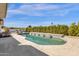 A stunning pool with tile accents is surrounded by lush landscaping, providing a private and serene outdoor living space at 9136 N 81St St, Scottsdale, AZ 85258