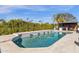 This shimmering pool is equipped with water features, surrounded by lush landscaping and a barbecue area for outdoor entertaining at 9136 N 81St St, Scottsdale, AZ 85258