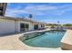 Relax by the pool in this backyard oasis, featuring tiled accents and a seamless connection to the home's interior at 9136 N 81St St, Scottsdale, AZ 85258