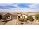 Beautiful single-Gathering home showcasing a well-manicured front yard and an attached two-car garage at 9426 W Daley Ln, Peoria, AZ 85383