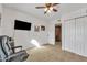 Bedroom featuring carpeted floors and a ceiling fan at 10015 N 14Th St # 10, Phoenix, AZ 85020