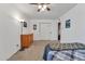 Bedroom with plush carpeting, ceiling fan, and ample closet space at 10015 N 14Th St # 10, Phoenix, AZ 85020