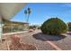 Inviting backyard boasts a screened-in porch and mature landscaping for outdoor enjoyment at 10321 W Pine Springs Dr, Sun City, AZ 85373