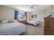 Bedroom featuring carpet and a window with drapes for natural light at 10321 W Pine Springs Dr, Sun City, AZ 85373