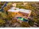 Aerial view of a luxury home with a pool, outdoor living space, and desert landscaping at 1084 N Boulder Dr, Carefree, AZ 85377