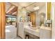 Elegant bathroom with a skylight, wood ceiling, and serene vanity at 1084 N Boulder Dr, Carefree, AZ 85377