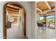 Archway view into the dining area with rustic wood ceiling, fireplace, and scenic views of the outdoors at 1084 N Boulder Dr, Carefree, AZ 85377