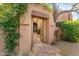 Charming entryway featuring desert landscaping, stone pathway, and wooden gate at 1084 N Boulder Dr, Carefree, AZ 85377