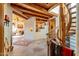 Spacious foyer featuring stone floors, wood beam ceilings, and a unique spiral staircase at 1084 N Boulder Dr, Carefree, AZ 85377