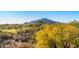 A scenic view overlooking a desert golf course and mountains at 1084 N Boulder Dr, Carefree, AZ 85377