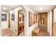 Hallway featuring tile floors, southwestern decor, and an open doorway to a bathroom at 1084 N Boulder Dr, Carefree, AZ 85377