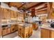 Gourmet kitchen with custom wood cabinets, granite countertops, stainless steel appliances, and a spacious center island at 1084 N Boulder Dr, Carefree, AZ 85377
