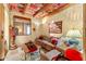 Cozy living room featuring beamed ceilings, Saltillo tile, and rustic furniture at 1084 N Boulder Dr, Carefree, AZ 85377