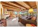 Spacious main bedroom with a fireplace, wood ceiling beams and private patio access at 1084 N Boulder Dr, Carefree, AZ 85377