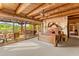 Primary bedroom featuring a wooden beam ceiling, exterior access, and views of the desert landscape at 1084 N Boulder Dr, Carefree, AZ 85377