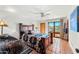 Bedroom featuring tile floors, ceiling fan, rustic wooden accents, and mountain views at 1084 N Boulder Dr, Carefree, AZ 85377