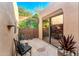 Cozy patio featuring rustic furniture, privacy fence and sliding door into bedroom at 1084 N Boulder Dr, Carefree, AZ 85377