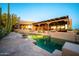 Back of home featuring the pool and patio space with exterior wooden beams at 1084 N Boulder Dr, Carefree, AZ 85377