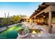 Gorgeous desert home with a custom pool, spa, covered patio, and lush desert landscaping at 1084 N Boulder Dr, Carefree, AZ 85377