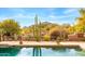 Scenic backyard pool with desert landscaping, mountain views, and flagstone patio at 1084 N Boulder Dr, Carefree, AZ 85377