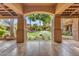 View of the backyard featuring a lush lawn, mature trees, and an inviting outdoor living space at 11505 E Cochise Dr, Scottsdale, AZ 85259