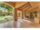 Covered patio overlooking a lush lawn with outdoor seating and entertainment areas at 11505 E Cochise Dr, Scottsdale, AZ 85259