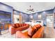 Spacious bedroom featuring multiple beds and a cozy seating area with orange couches at 11505 E Cochise Dr, Scottsdale, AZ 85259