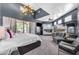 Expansive bedroom with a chandelier, bunkbeds, and sliding glass doors to the backyard at 11505 E Cochise Dr, Scottsdale, AZ 85259