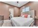 Comfortable bedroom offers a king bed, and an ensuite bathroom with a sink and toilet at 11505 E Cochise Dr, Scottsdale, AZ 85259