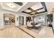 Dining room featuring coffered ceilings, modern chandelier, and elegant furniture at 11505 E Cochise Dr, Scottsdale, AZ 85259