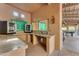 Well-equipped outdoor kitchen area with modern appliances, sink, and ample counter space for entertaining at 11505 E Cochise Dr, Scottsdale, AZ 85259