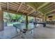 Outdoor area with ping pong and billiards tables perfect for entertaining at 11505 E Cochise Dr, Scottsdale, AZ 85259