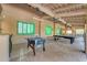 Outdoor game room with foosball, ping pong, and billiards tables for entertainment at 11505 E Cochise Dr, Scottsdale, AZ 85259