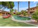 Luxurious pool surrounded by lush greenery and comfortable lounge seating at 11505 E Cochise Dr, Scottsdale, AZ 85259