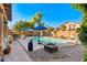 Expansive backyard with pool, gazebo, and lush desert landscaping at 11866 N 143Rd Ave, Surprise, AZ 85379
